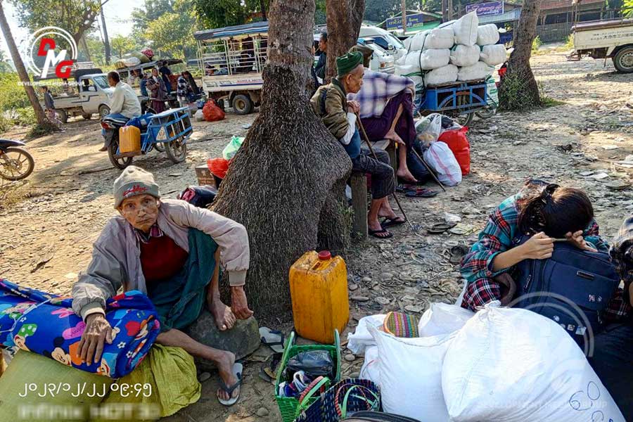 Residents in Mrauk-U preparing to flee to safer locations are pictured on December 22.
